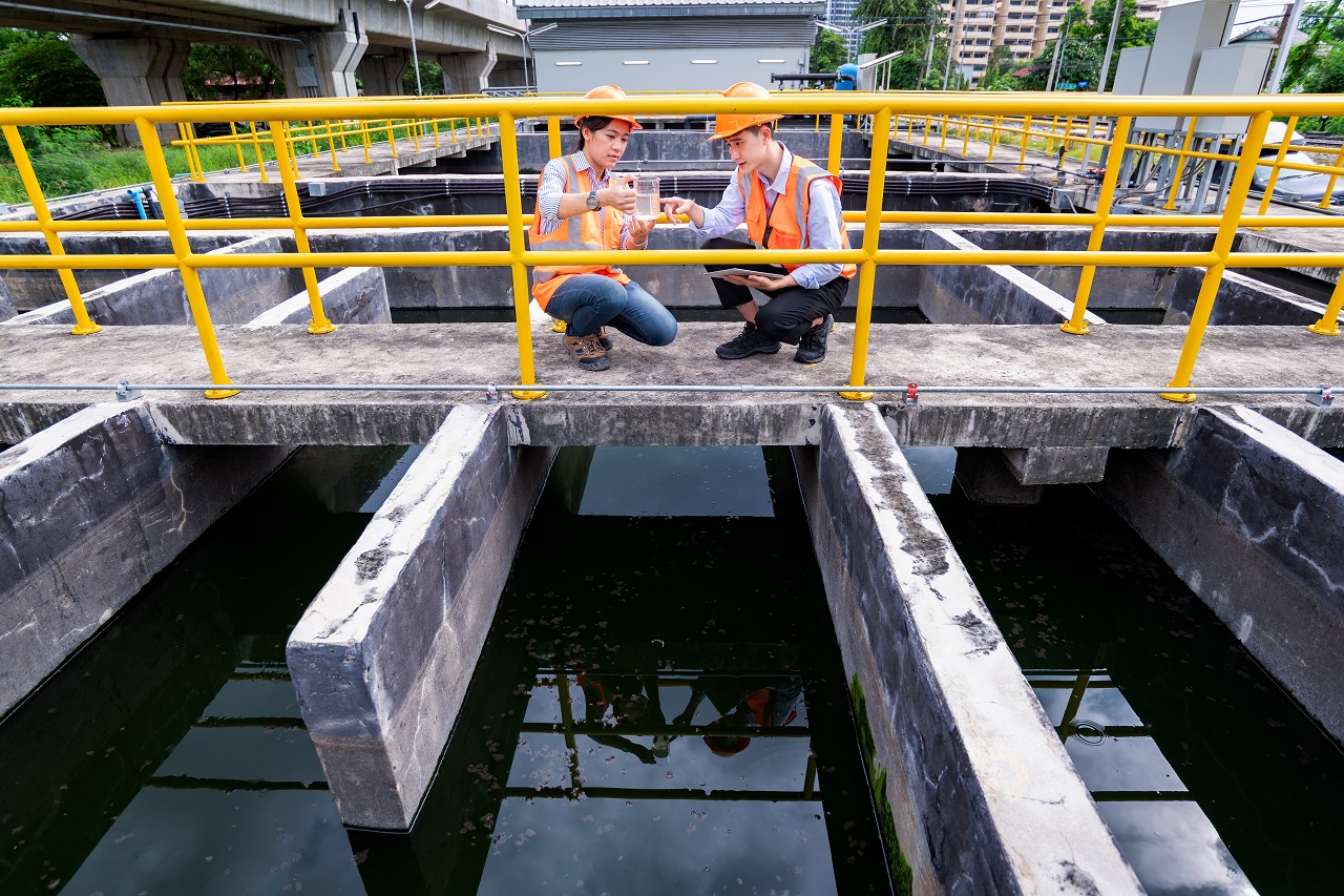 engineer take water from wastewater treatment pond 2023 11 27 05 18 03 utc